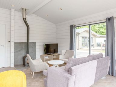 A living room with a sofa and television at Leyburn (Pet) Leyburn