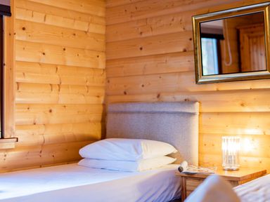 A bedroom with a bed and bedside table at Maple Lodge in Louth