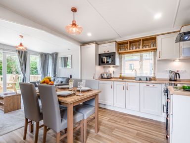 A kitchen with table and chairs at Caistor Spa in Louth