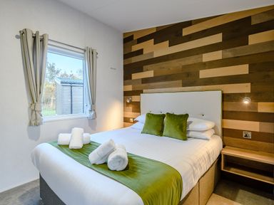 A bedroom with a bed and window at Horncastle Plus Louth