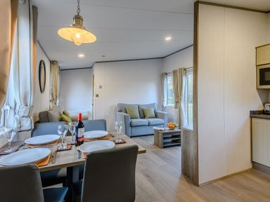 A dining room with a table and chairs at Horncastle Plus in Louth