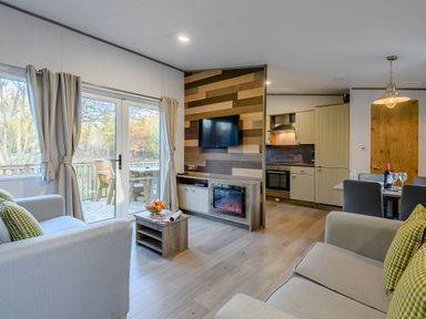 A living room with a sofa and television at Horncastle Plus in Louth