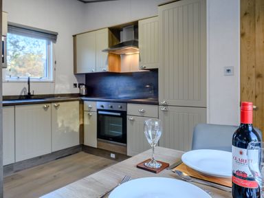 A kitchen with cabinets and an oven at Horncastle Plus in Louth