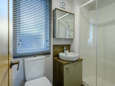 A bathroom with a sink and toilet at Horncastle Plus in Louth