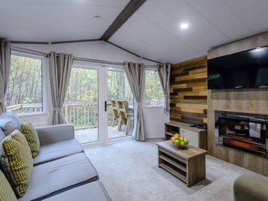 A living room with a sofa and television at Alford Spa in Louth