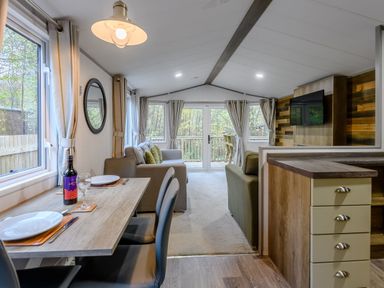 A living room with a dining table and sofa at Alford Spa in Louth
