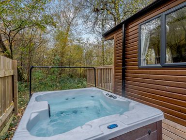 A hot tub located on a wooden deck in an outdoor area at Alford Spa in Louth