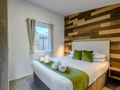 A bedroom with a bed and window at Horncastle Spa in Louth