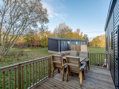 An outdoor area with a deck and seating at Horncastle Spa Louth