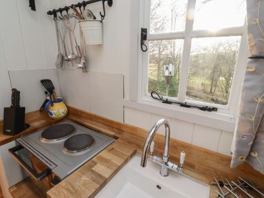 A kitchen with a sink and stove at Meadows in Hexham