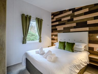 A bedroom with a bed and window at The Kinder Spa (Pet) in Louth