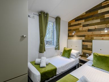 A bedroom with two beds and a window at Alford Spa (Pet) Louth