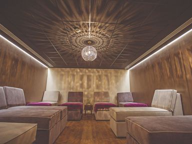 A spa room with seating and chandelier at Alford Spa (Pet) Louth