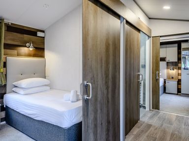 A bedroom with a bed and sliding doors at Alford WF in Louth