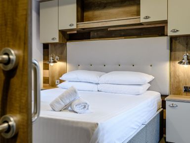 A bedroom with a bed and shelves at Alford WF in Louth