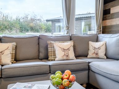 A living room with a sofa and a fruit bowl at Alford WF in Louth