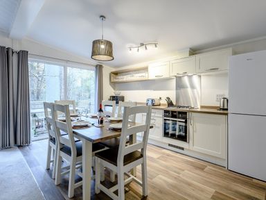 A dining room with a table and chairs at Stamford Spa in Louth