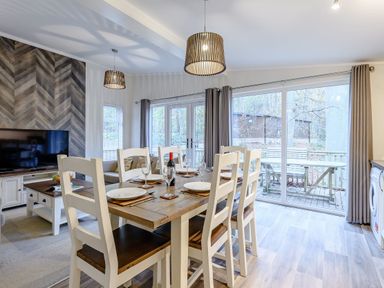 A dining room with a table and chairs at Stamford Spa in Louth