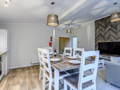 A dining room with a table and chairs at Stamford Spa in Louth