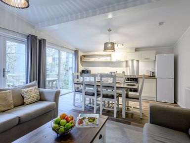 A kitchen with dining area and sofa at Stamford Spa (Pet) in Louth