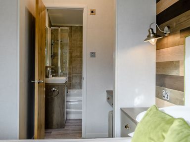A bathroom with a sink and shower at Elsham Lodge (Pet) in Louth