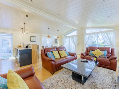 A living room with a sofa and coffee table at Retreat Lodge 4 in Louth