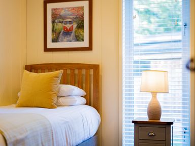 A bedroom with a bed and nightstand at Retreat Lodge 4 in Louth