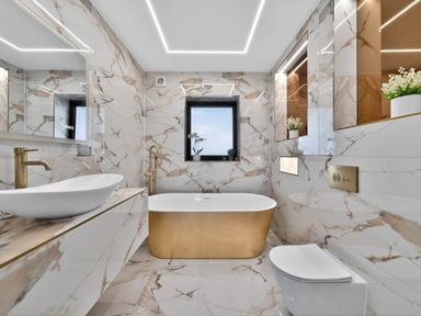 A bathroom with a bathtub and sink at Heddfan in Carmarthen