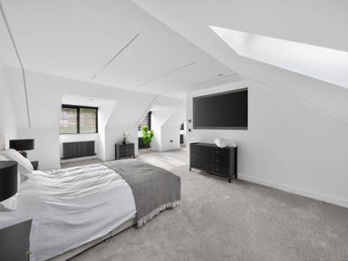 A bedroom with a bed and a dresser at Ty Uchel 