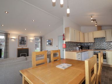 A dining room with a table and chairs at Colonsay