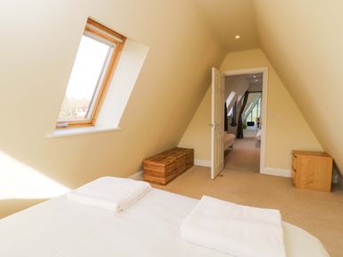 A bedroom with a bed and window at Lady Of Lourdes Whitchurch, Herefordshire
