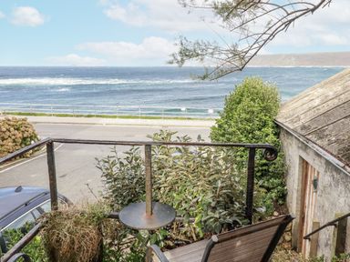 A view of the ocean from a balcony at Cove Retreat in Penzance