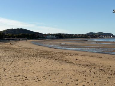 A beach with sand and water at The Beachside Hideout - St Michaels Caravan Park in Towyn