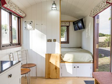 A bedroom with a bed and television at No 1 The Orchard, Upton Warren