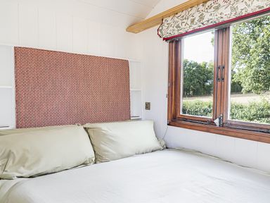 A bedroom with a bed and window at No 1 The Orchard Upton Warren