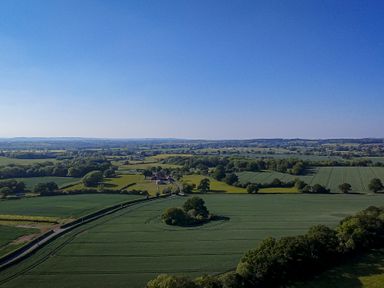 A landscape view of fields and trees at No 1 The Orchard Upton Warren