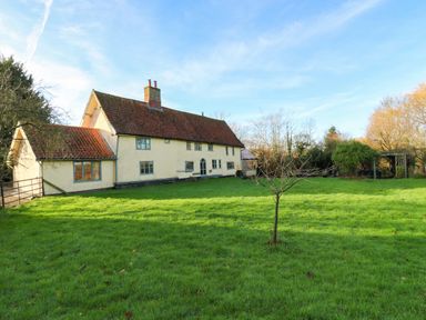 A house with a garden and grass at Town Farm in 
