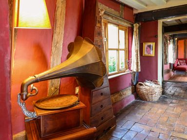 A living room with a gramophone and window at Town Farm