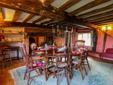 A dining room with a table set for dinner at Town Farm