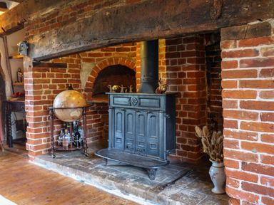 A snug with a wood stove and globe at Town Farm 