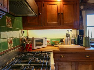 A kitchen with appliances and utensils at Town Farm