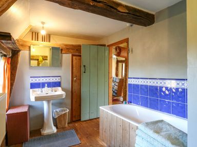 A bathroom with a sink and bathtub at Town Farm in 