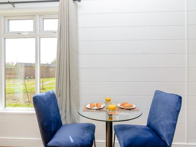 A dining room with a table and chairs at The Elton in Kings Cliffe