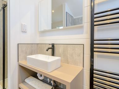 A bathroom with a sink and mirror at The Castor in Kings Cliffe