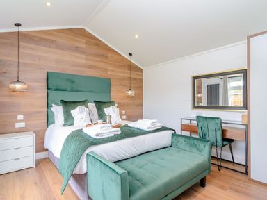 A bedroom with a bed and desk at The Castor in Kings Cliffe