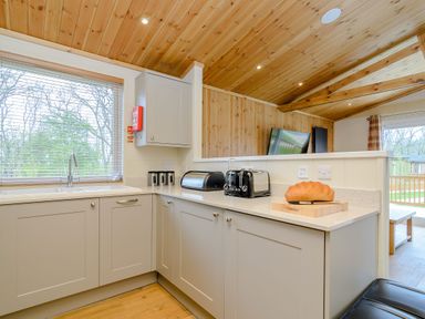 A kitchen with a sink and toaster at The Sutton in Kings Cliffe