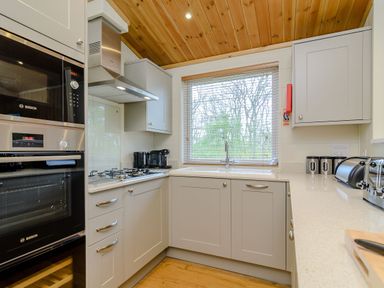 A kitchen with countertop, sink, stove, and appliances at The Sutton in Kings Cliffe