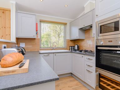 A kitchen with a sink and appliances at The Chesterton in Kings Cliffe