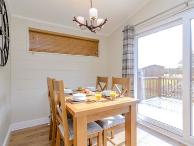 A dining room with a table set for breakfast at The Chesterton in Kings Cliffe