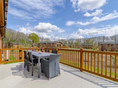 A patio with table and chairs at The Yarwell in Kings Cliffe